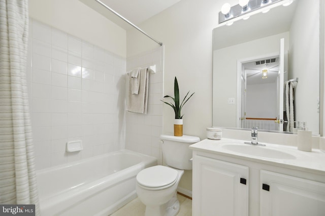 bathroom with visible vents, vanity, toilet, and shower / bath combo with shower curtain