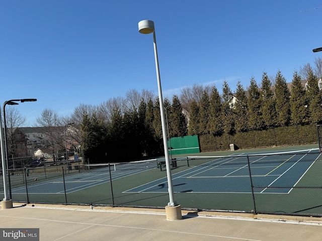 view of sport court with fence