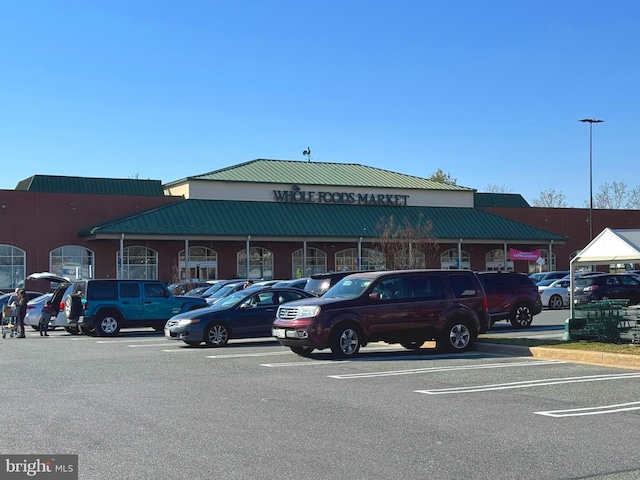 view of property featuring uncovered parking