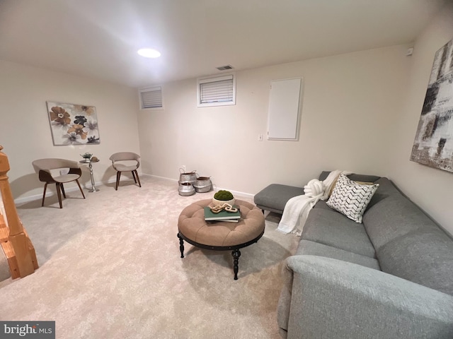 living area featuring carpet, visible vents, and baseboards