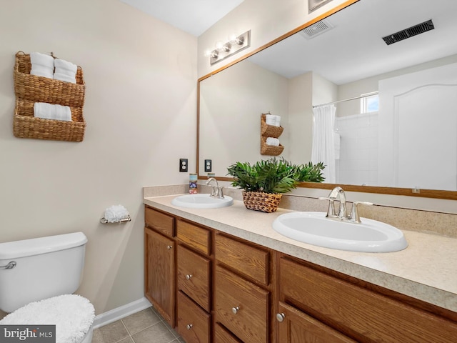 full bathroom featuring tile patterned floors, visible vents, and a sink