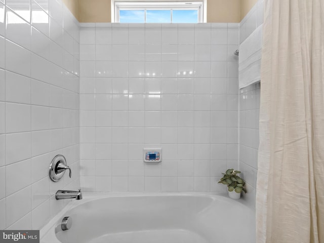 full bathroom featuring shower / bathtub combination with curtain