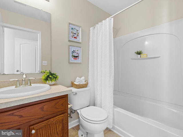 full bathroom featuring tile patterned floors, shower / bath combo with shower curtain, toilet, and vanity