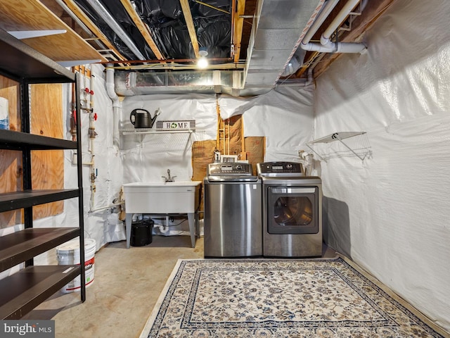 unfinished below grade area featuring independent washer and dryer and a sink