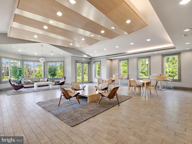 living room with recessed lighting, light wood-type flooring, baseboards, and visible vents