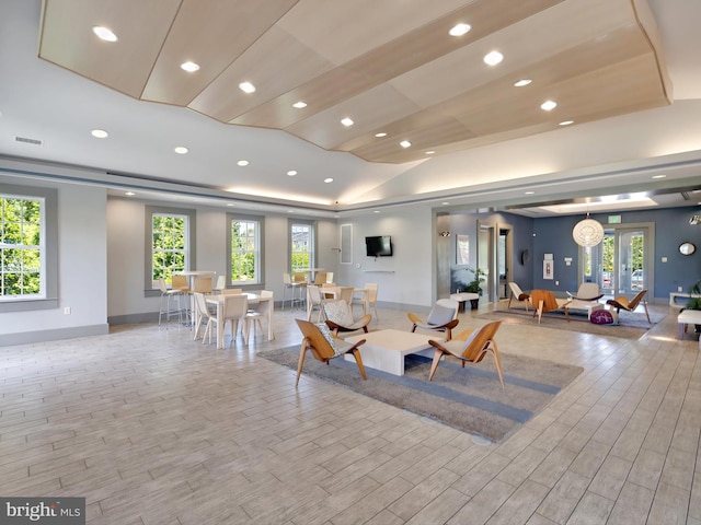 living room with visible vents, recessed lighting, and wood finished floors