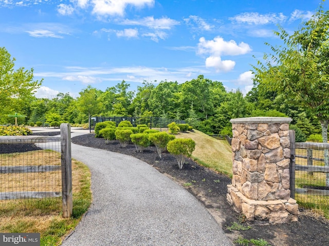 view of community with fence