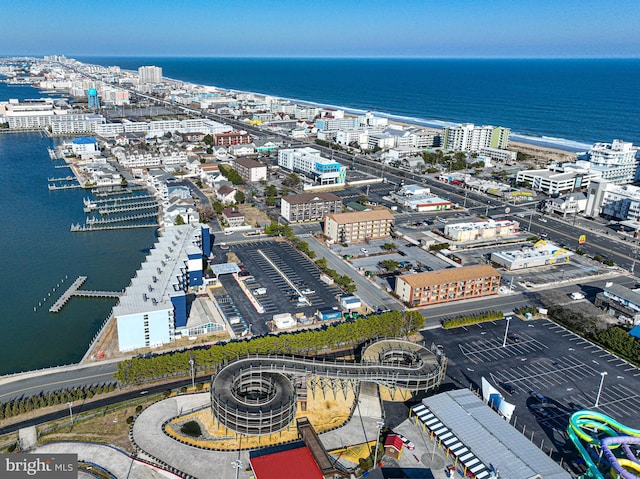 drone / aerial view featuring a view of city and a water view