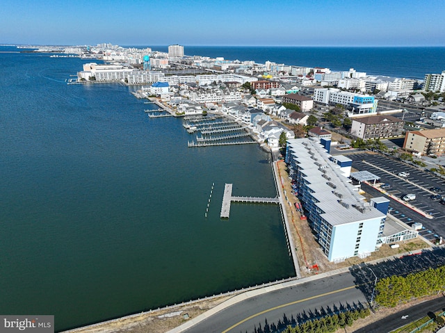 birds eye view of property featuring a view of city and a water view