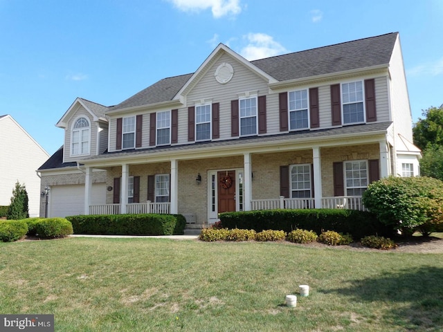 colonial-style house featuring brick siding, a porch, and a front yard