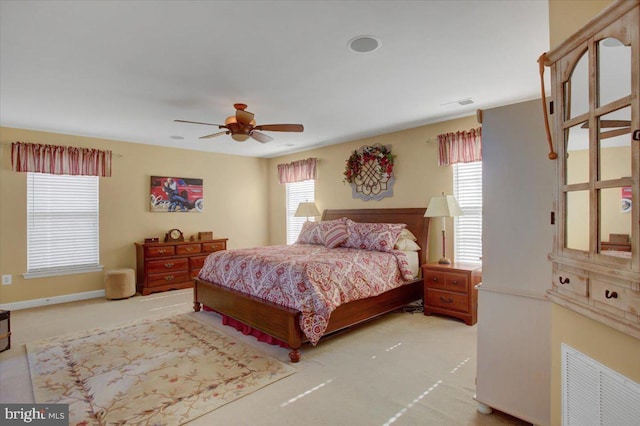 bedroom with visible vents, baseboards, carpet, and ceiling fan