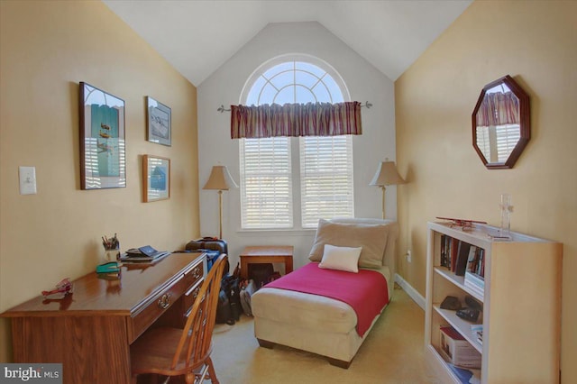 living area with vaulted ceiling, plenty of natural light, and carpet floors