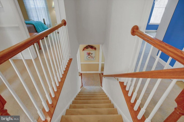 stairs featuring baseboards