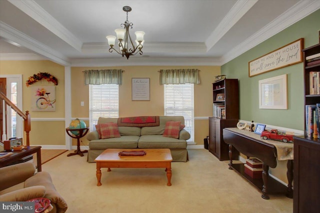 living area featuring stairway, an inviting chandelier, crown molding, a raised ceiling, and light colored carpet