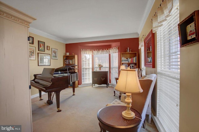 sitting room featuring baseboards, carpet floors, and ornamental molding