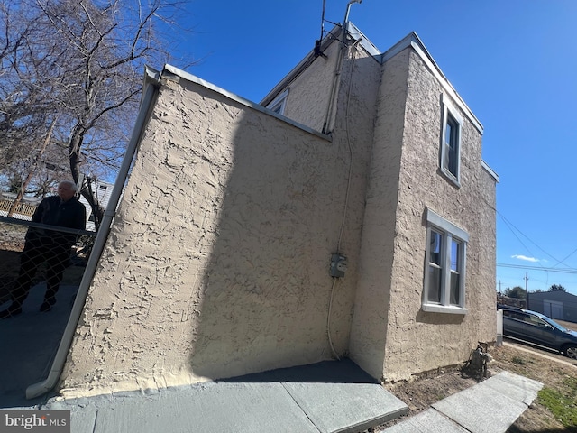 view of home's exterior with stucco siding