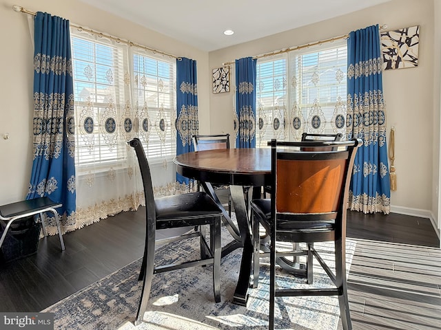 dining room featuring recessed lighting, baseboards, and wood finished floors