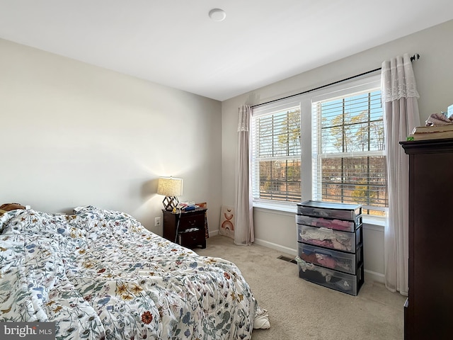 carpeted bedroom with baseboards