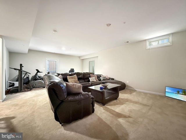 living room featuring light carpet, visible vents, and baseboards