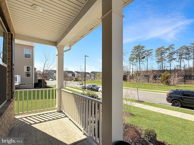 balcony with a residential view and covered porch