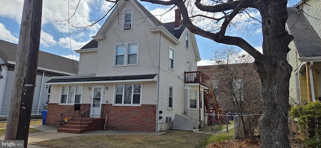 view of front of house featuring brick siding