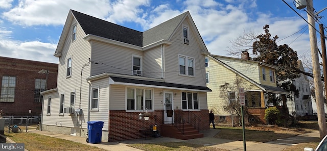 view of front of property featuring brick siding