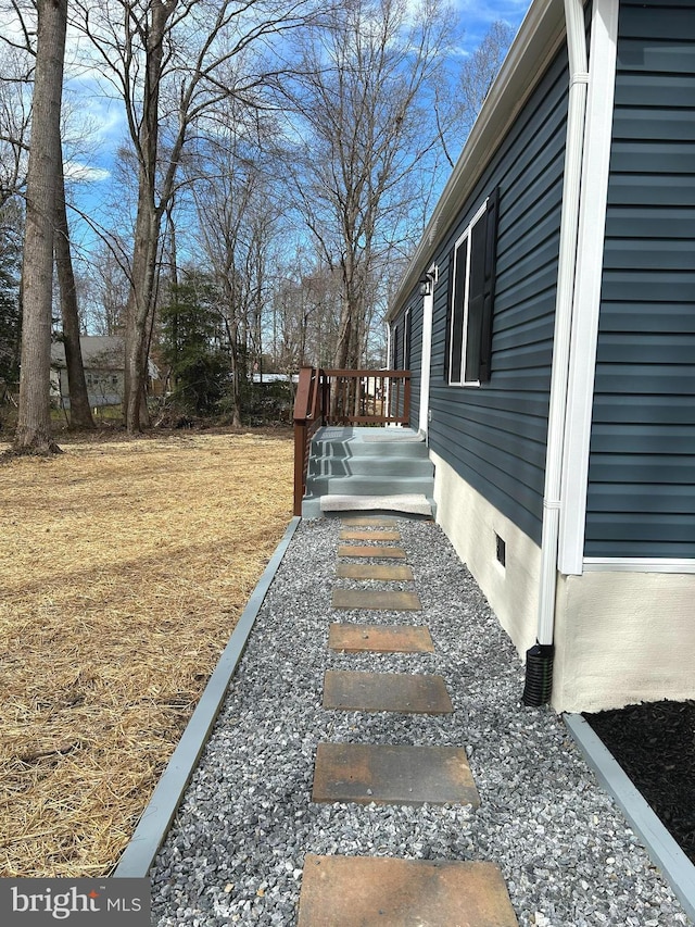 view of home's exterior featuring crawl space