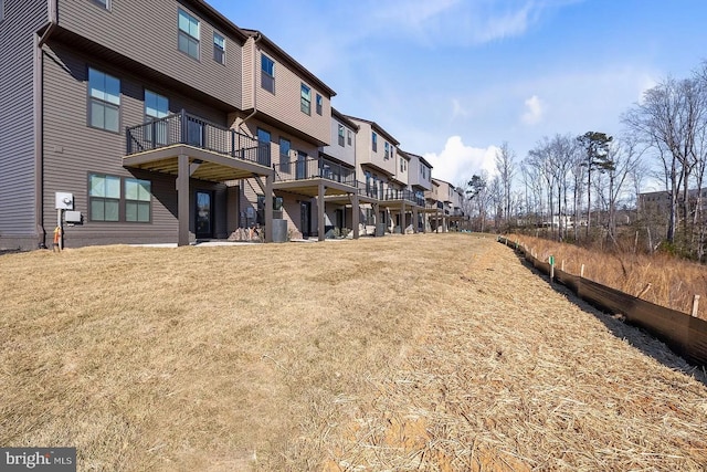 view of community with a yard and a residential view