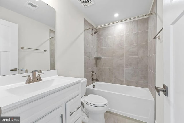 bathroom featuring shower / bathing tub combination, visible vents, toilet, and vanity