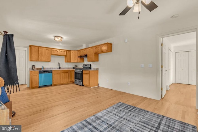 kitchen with dishwasher, light wood-style flooring, stainless steel gas range, light countertops, and under cabinet range hood