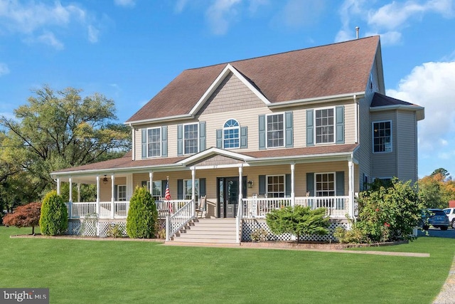 colonial house featuring a front lawn and a porch