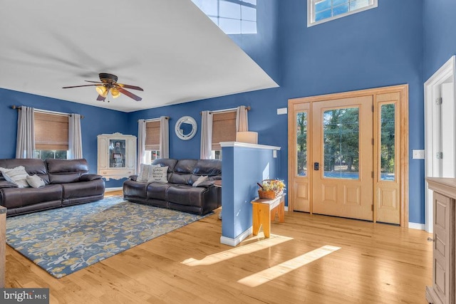 living area featuring wood finished floors and a healthy amount of sunlight