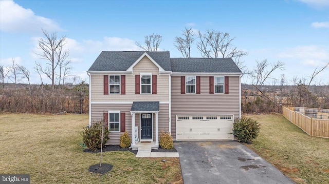 traditional home featuring a garage, a shingled roof, aphalt driveway, fence, and a front yard