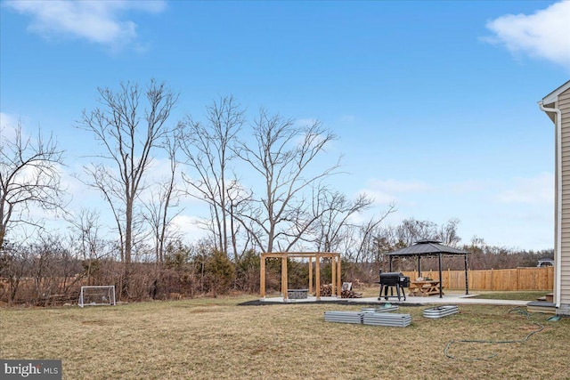 view of playground featuring a gazebo, a patio, fence, and a pergola