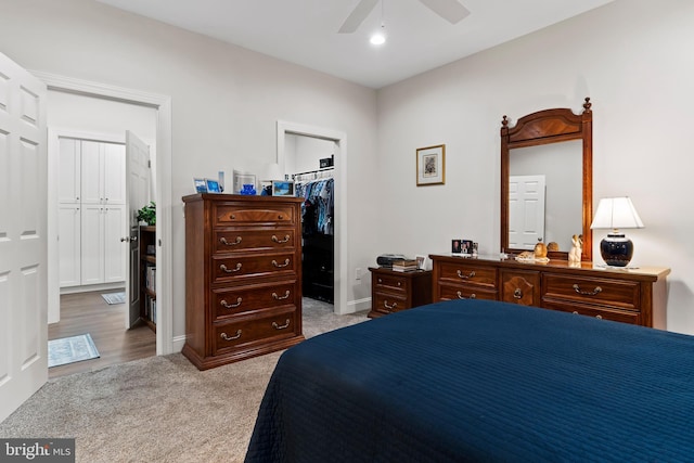 carpeted bedroom with ceiling fan, recessed lighting, baseboards, a spacious closet, and a closet