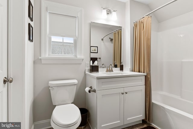 bathroom with shower / bath combo, vanity, and toilet