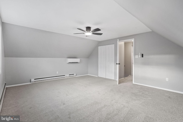 bonus room with carpet floors, vaulted ceiling, baseboard heating, and a wall mounted AC