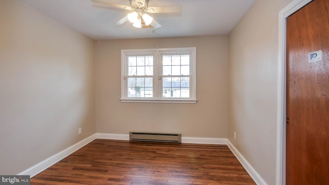 spare room featuring wood finished floors, a ceiling fan, baseboards, and a baseboard radiator