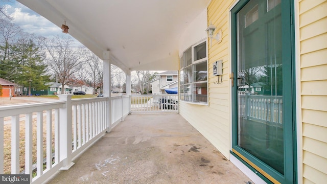 view of patio / terrace featuring covered porch and a residential view