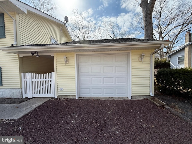 garage featuring driveway