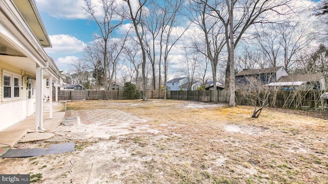 view of yard featuring a patio area and a fenced backyard