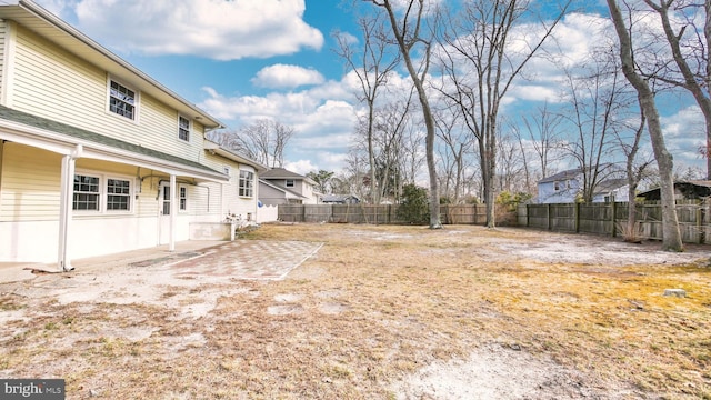 view of yard with a patio area and a fenced backyard