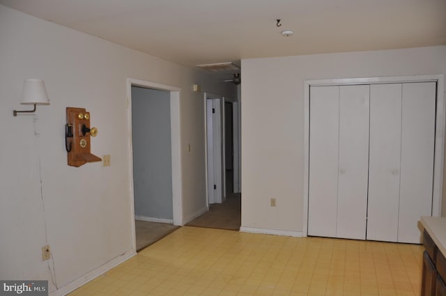 unfurnished bedroom with a closet, baseboards, visible vents, and light floors