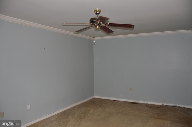 empty room featuring crown molding, visible vents, carpet flooring, ceiling fan, and baseboards