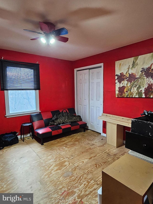 interior space featuring a closet and a ceiling fan