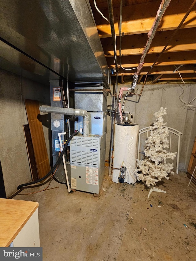 utility room with heating unit and water heater