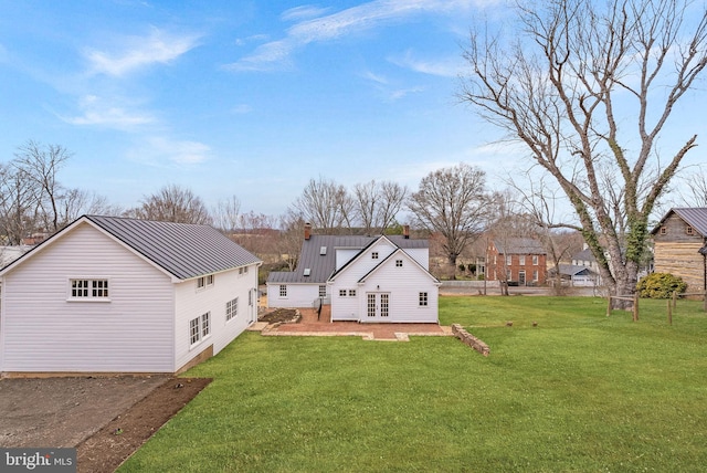 15570 Second St, Waterford, VA 20197 - rear view of property with a yard, metal roof, french doors, and a chimney