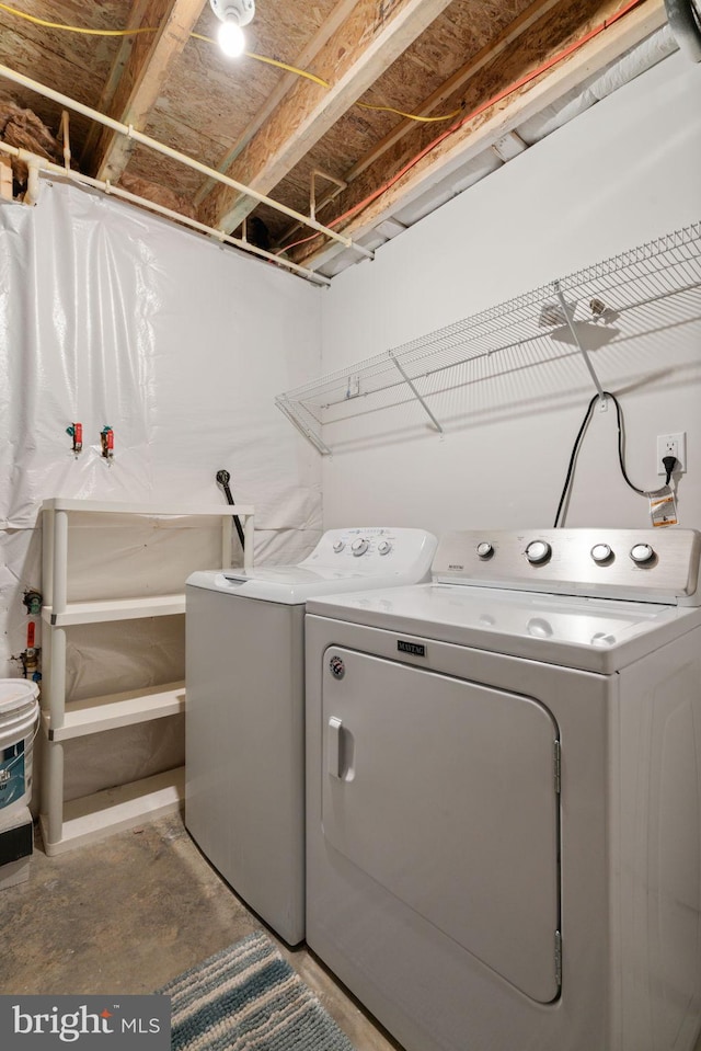 washroom with laundry area and separate washer and dryer