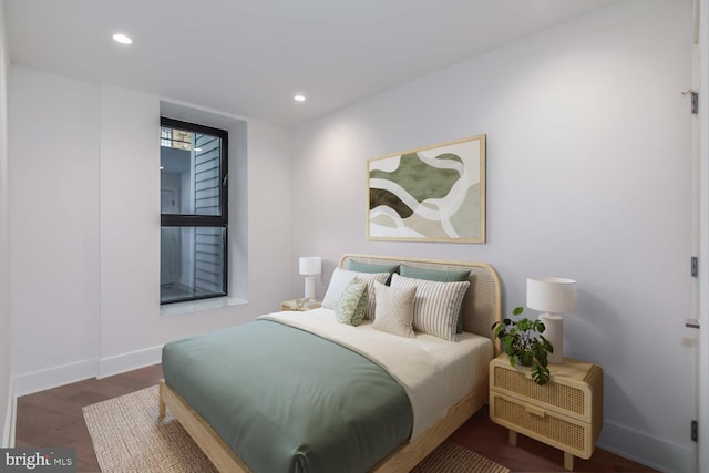 bedroom with recessed lighting, wood finished floors, and baseboards