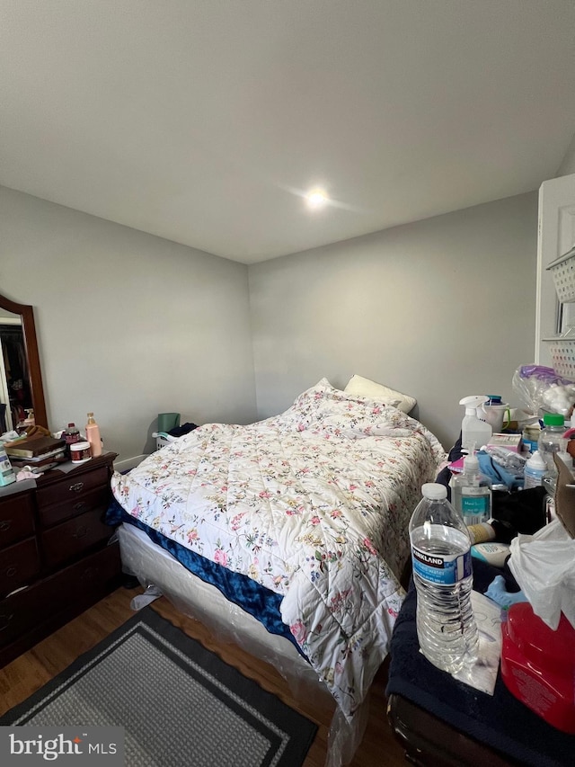 bedroom featuring wood finished floors